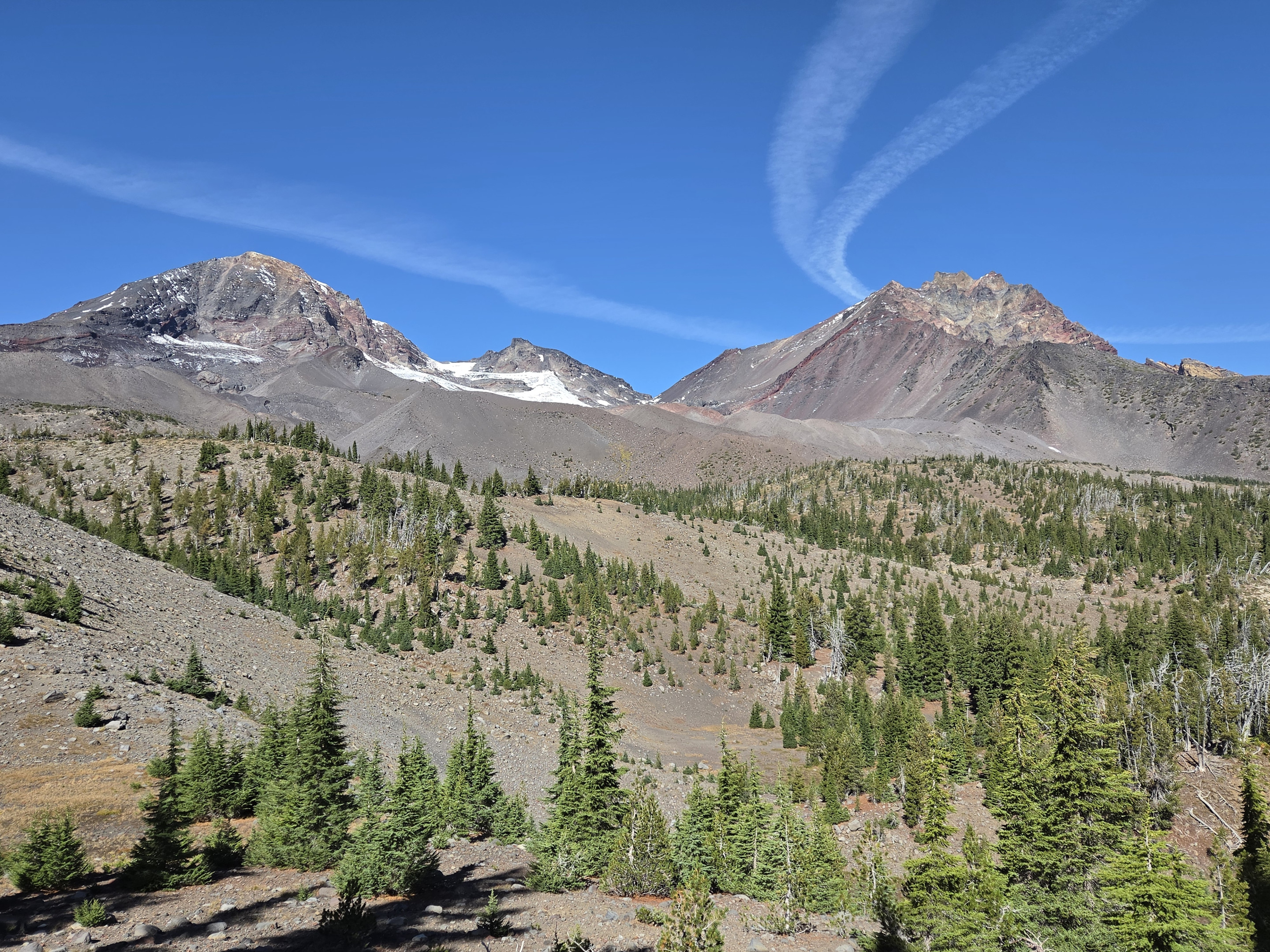Middle Sister, Prouty Point and North Sister rise above the trail to Camp Lake.
